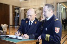 Djordjevic signs book of condolences at Russian Embassy